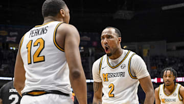 Mar 13, 2025; Nashville, TN, USA;  Missouri Tigers guard Tamar Bates (2) celebrates the foul with guard Tony Perkins (12) against the Mississippi State Bulldogs during the second half at Bridgestone Arena. Mandatory Credit: Steve Roberts-Imagn Images