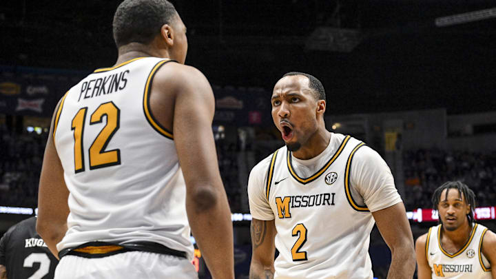 Mar 13, 2025; Nashville, TN, USA;  Missouri Tigers guard Tamar Bates (2) celebrates the foul with guard Tony Perkins (12) against the Mississippi State Bulldogs during the second half at Bridgestone Arena. Mandatory Credit: Steve Roberts-Imagn Images