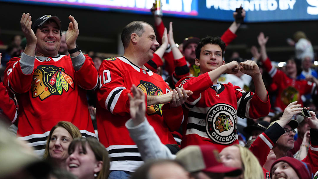 Feb 28, 2026; Denver, Colorado, USA; Chicago Blackhawks fans celebrate a goal scored in the first period against the Colorado Avalancheat Ball Arena. Mandatory Credit: Ron Chenoy-Imagn Images