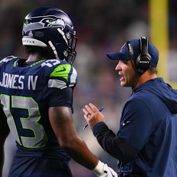 Oct 20, 2025; Seattle, Washington, USA; Seattle Seahawks linebacker Ernest Jones IV (13) talks with Seattle Seahawks head coach Mike Macdonald during the fourth quarter against the Houston Texans at Lumen Field.