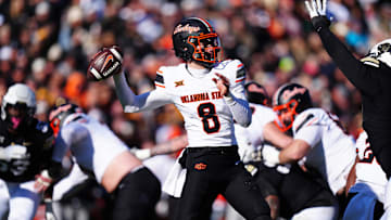 Nov 29, 2024; Boulder, Colorado, USA; Oklahoma State Cowboys quarterback Maealiuaki Smith (8 prepares to pass the ball in the second quarter against the Colorado Buffaloes at Folsom Field. Mandatory Credit: Ron Chenoy-Imagn Images