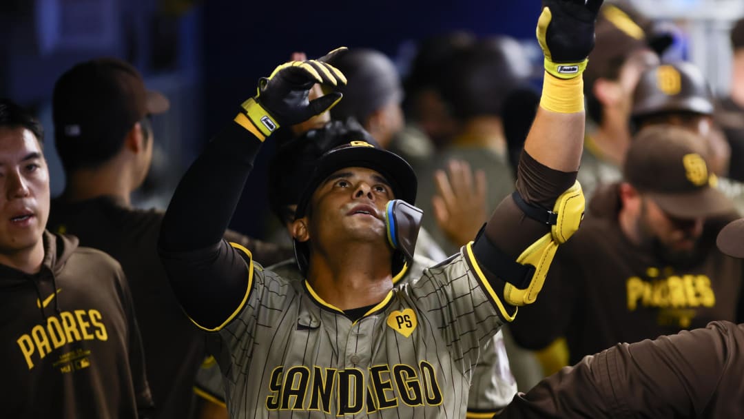 Aug 11, 2024; Miami, Florida, USA; San Diego Padres pinch-hitter Donovan Solano (39) celebrates after hitting a two-run home run against the Miami Marlins during the eighth inning at loanDepot Park. Mandatory Credit: Sam Navarro-USA TODAY Sports