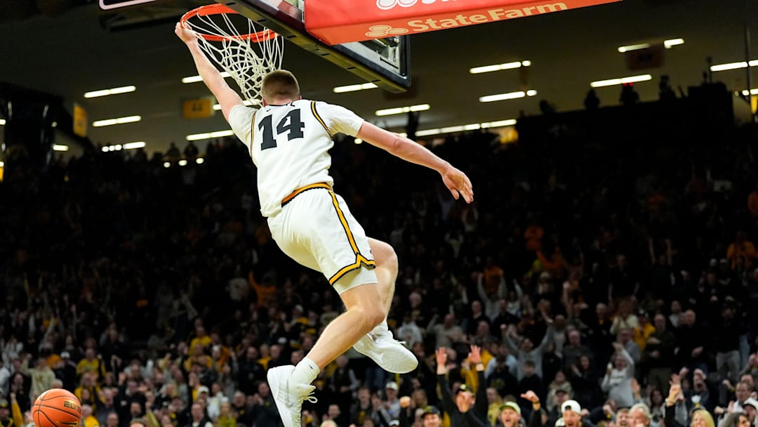 Iowa guard Bennett Stirtz (14) dunks to give the Iowa Hawkeyes their first lead against the USC Trojans Jan. 28, 2026 at Carver-Hawkeye Arena in Iowa City, Iowa. Iowa guard Bennett Stirtz (14) dunks to give the Iowa Hawkeyes their first lead against the USC Trojans Jan. 28, 2026 at Carver-Hawkeye Arena in Iowa City, Iowa.
