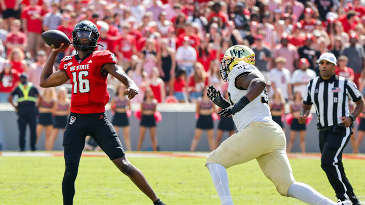 NC State's CJ Bailey attempts a pass against Wake Forest. NC State's CJ Bailey attempts a pass against Wake Forest.