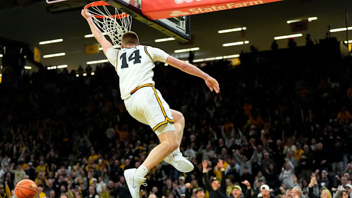 Iowa guard Bennett Stirtz (14) dunks to give the Iowa Hawkeyes their first lead against the USC Trojans Jan. 28, 2026 at Carver-Hawkeye Arena in Iowa City, Iowa.