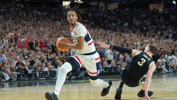 Apr 8, 2024; Glendale, AZ, USA; Connecticut Huskies guard Stephon Castle (5) controls the ball against Purdue Boilermakers guard Braden Smith (3) during the first half of the national championship game of the Final Four of the 2024 NCAA Tournament at State Farm Stadium. Mandatory Credit: Bob Donnan-USA TODAY Sports