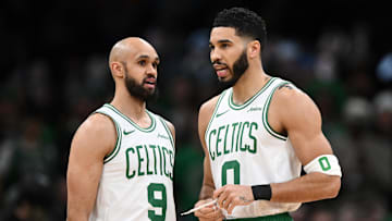Feb 12, 2025; Boston, Massachusetts, USA; Boston Celtics guard Derrick White (9) and forward Jayson Tatum (0) talk before a game against the San Antonio Spurs at the TD Garden. Mandatory Credit: Brian Fluharty-Imagn Images