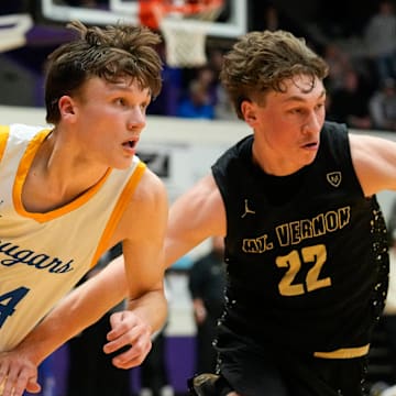 Greenfield-Central Cougars guard Braylon Mullins (24) rushes up the court against Mt. Vernon Marauders Tanner Teschendorf (22) on Saturday, March 8, 2025, during the IHSAA boys basketball sectional final at Muncie Fieldhouse in Muncie. Mt. Vernon Marauders defeated the Greenfield-Central Cougars in double overtime, 76-73.