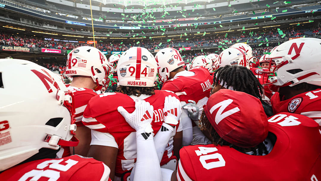 Nebraska players celebrate their victory in the 2024 Pinstripe Bowl.