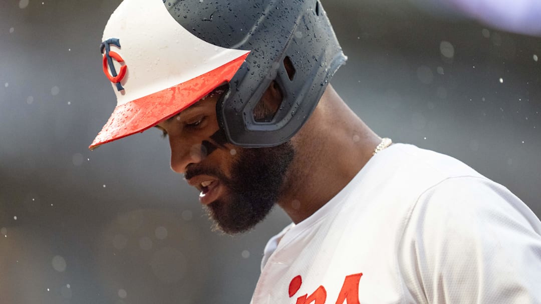 Jul 4, 2024; Minneapolis, Minnesota, USA; Minnesota Twins shortstop Willi Castro (50) walks to the dugout in the fifth inning against the Detroit Tigers as the rain comes down at Target Field. Mandatory Credit: Matt Blewett-Imagn Images