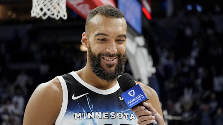 Apr 11, 2025; Minneapolis, Minnesota, USA; Minnesota Timberwolves center Rudy Gobert (27) smiles during an interview after the game against the Brooklyn Nets at Target Center. Mandatory Credit: Bruce Kluckhohn-Imagn Images