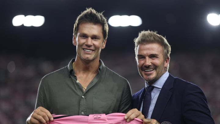 Aug 24, 2024; Fort Lauderdale, Florida, USA; Inter Miami president and co-owner David Beckham presents a jersey to former NFL player Tom Brady  during the match between the FC Cincinnati and the Inter Miami at Chase Stadium. Mandatory Credit: Nathan Ray Seebeck-USA TODAY Sports