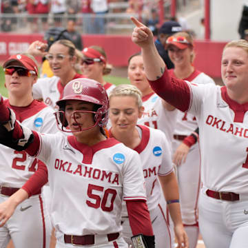 Oklahoma's Ailana Agbayani celebrates after hitting a three-run home run.
