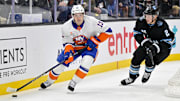 Jan 11, 2025; Salt Lake City, Utah, USA; New York Islanders center Mathew Barzal (13) moves the puck against Utah Hockey Club defenseman Olli Maatta (2) during third period at the Delta Center. Mandatory Credit: Christopher Creveling-Imagn Images