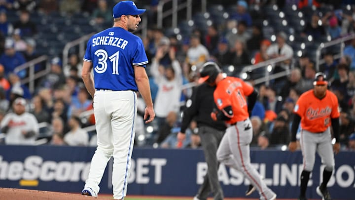 Mar 29, 2025; Toronto, Ontario, CAN; Toronto Blue Jays pitcher Max Scherzer (31) waits for a new ball as Baltimore Orioles second baseman Jordan Westburg (11) rounds the bases after hitting a solo home run in the first inning at Rogers Centre. Mandatory Credit: Dan Hamilton-Imagn Images