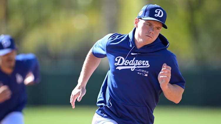 Feb 19, 2024; Glendale, AZ, USA; Los Angeles Dodgers catcher Will Smith (16) participates in base