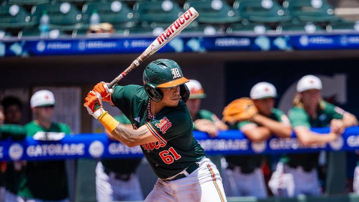 May 23, 2024; Charlotte, NC, USA; Miami (Fl) Hurricanes catcher Carlos Perez (61) at bat against the Clemson Tigers in the third inning during the ACC Baseball Tournament at Truist Field. Mandatory Credit: Scott Kinser-Imagn Images