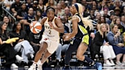 Aug 1, 2025; Dallas, Texas, USA;  Indiana Fever guard Aari McDonald (2) drives to the basket past Dallas Wings guard DiJonai Carrington (21) during the second half at the American Airlines Center. Mandatory Credit: Jerome Miron-Imagn Images