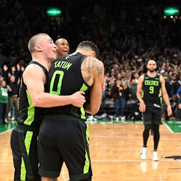 Nov 16, 2024; Boston, Massachusetts, USA; Boston Celtics forward Jayson Tatum (0) celebrates with forward Sam Hauser (30), guard Payton Pritchard (11), and center Luke Kornet (40) after making the game wining basket against the Toronto Raptors in overtime at the TD Garden. Mandatory Credit: Brian Fluharty-Imagn Images