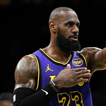 Mar 8, 2025; Boston, Massachusetts, USA; Los Angeles Lakers forward LeBron James (23) calls a play against the Boston Celtics during the second quarter at the TD Garden. 