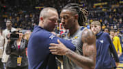 Mar 8, 2025; Morgantown, West Virginia, USA; West Virginia Mountaineers head coach Darian DeVries and guard Javon Small (7) celebrate after defeating the UCF Knights at WVU Coliseum. Mandatory Credit: Ben Queen-Imagn Images
