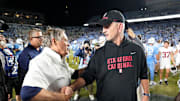 Nov 8, 2025; Chapel Hill, North Carolina, USA; North Carolina Tar Heels head coach Bill Belichick with Stanford Cardinal head coach Frank Reich after the game at Kenan Stadium. Mandatory Credit: Bob Donnan-Imagn Images