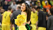 Jan 2, 2025; Eugene, Oregon, USA; Oregon Ducks cheerleader performs during a time out in the second half against the Illinois Fighting Illini at Matthew Knight Arena. Mandatory Credit: Craig Strobeck-Imagn Images