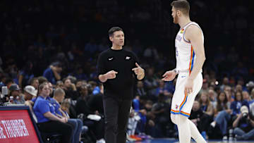 Oct 9, 2024; Oklahoma City, Oklahoma, USA; Oklahoma City Thunder head coach Mark Daigneault talks to center Isaiah Hartenstein (55) during the first quarter against Houston at Paycom Center. Mandatory Credit: Alonzo Adams-Imagn Images