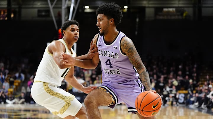 Feb 25, 2026; Boulder, Colorado, USA; Colorado Buffaloes guard Jalin Holland (11) defends on Kansas State Wildcats guard PJ Haggerty (4) in the first half at the CU Events Center. Mandatory Credit: Ron Chenoy-Imagn Images