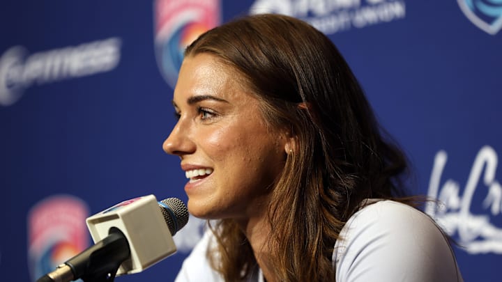 Alex Morgan announces her retirement at a press conference Friday