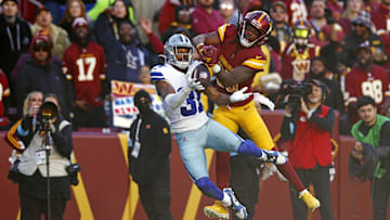 Nov 24, 2024; Landover, Maryland, USA; Dallas Cowboys cornerback Josh Butler (31) breaks up a pass intended for Washington Commanders wide receiver Noah Brown (85) during the second quarter at Northwest Stadium. Mandatory Credit: Peter Casey-Imagn Images