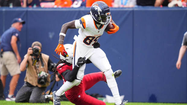 Arizona Cardinals safety Andre Chachere (36) tackles Denver Broncos wide receiver Brandon Johnson (89).