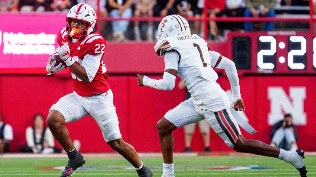 Sep 12, 2026; Lincoln, Nebraska, USA; Nebraska Cornhuskers running back Isaiah Mozee (22) runs against Bowling Green Falcons defensive back Drey Braxton (1) during the second quarter at Memorial Stadium. Mandatory Credit: Dylan Widger-Imagn Images Sep 12, 2026; Lincoln, Nebraska, USA; Nebraska Cornhuskers running back Isaiah Mozee (22) runs against Bowling Green Falcons defensive back Drey Braxton (1) during the second quarter at Memorial Stadium. Mandatory Credit: Dylan Widger-Imagn Images
