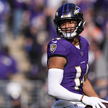 Nov 12, 2023; Baltimore, Maryland, USA;  Baltimore Ravens safety Kyle Hamilton (14) celebrates after scoring a touchdown against the Cleveland Browns during the first quarter at M&T Bank Stadium. Mandatory Credit: Jessica Rapfogel-Imagn Images