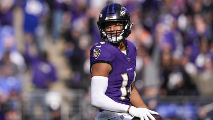 Nov 12, 2023; Baltimore, Maryland, USA;  Baltimore Ravens safety Kyle Hamilton (14) celebrates after scoring a touchdown against the Cleveland Browns during the first quarter at M&T Bank Stadium. Mandatory Credit: Jessica Rapfogel-USA TODAY Sports