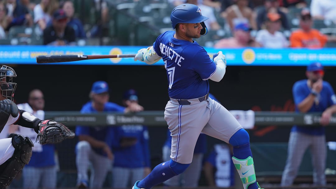 Jul 30, 2025; Baltimore, Maryland, USA; Toronto Blue Jays shortstop Bo Bichette (11) doubles to drive in two runs during the seventh inning against the Baltimore Oriolesat Oriole Park at Camden Yards. Mandatory Credit: Mitch Stringer-Imagn Images