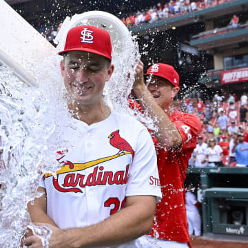 Jul 31, 2024; St. Louis, Missouri, USA;  St. Louis Cardinals starting pitcher Michael McGreevy (36) is doused with water by pitcher Miles Mikolas (left) and pitcher Kyle Gibson (right) after winning his first MLB game in his Major League Debut against the Texas Rangers at Busch Stadium. Mandatory Credit: Jeff Curry-USA TODAY Sports