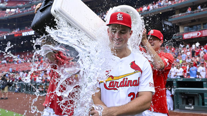 Jul 31, 2024; St. Louis, Missouri, USA;  St. Louis Cardinals starting pitcher Michael McGreevy (36) is doused with water by pitcher Miles Mikolas (left) and pitcher Kyle Gibson (right) after winning his first MLB game in his Major League Debut against the Texas Rangers at Busch Stadium. Mandatory Credit: Jeff Curry-USA TODAY Sports