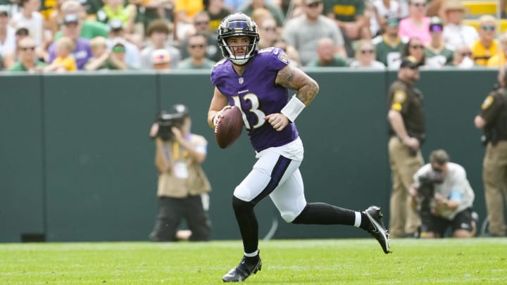 Aug 24, 2024; Green Bay, Wisconsin, USA;  Baltimore Ravens quarterback Devin Leary (13) looks to throw a pass during the second quarter against the Green Bay Packers at Lambeau Field. Mandatory Credit: Jeff Hanisch-USA TODAY Sports