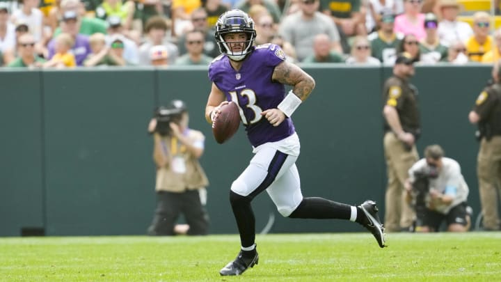 Aug 24, 2024; Green Bay, Wisconsin, USA;  Baltimore Ravens quarterback Devin Leary (13) looks to throw a pass during the second quarter against the Green Bay Packers at Lambeau Field. Mandatory Credit: Jeff Hanisch-USA TODAY Sports