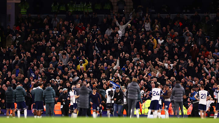 Spurs players acknowledge the jubilant away end after the game 