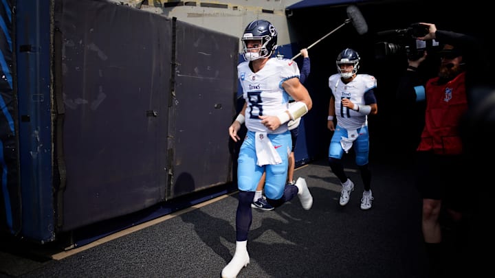 Tennessee Titans quarterback Will Levis (8) and Mason Rudolph (11) hit the field for warmups before the Chicago Bears game at Soldier Field in Chicago, Ill., Sunday, Sept. 8, 2024.