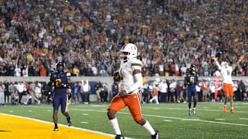 Oct 5, 2024; Berkeley, California, USA; Miami Hurricanes quarterback Cam Ward (1) rushes for a touchdown against the California Golden Bears during the fourth quarter at California Memorial Stadium. Mandatory Credit: Darren Yamashita-Imagn Images