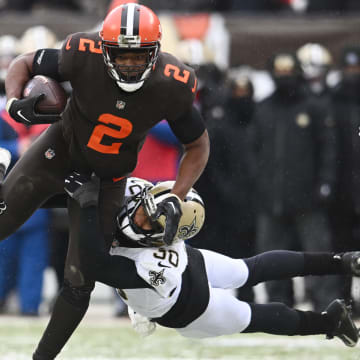 Dec 24, 2022; Cleveland, Ohio, USA; Cleveland Browns wide receiver Amari Cooper (2) is tackled by New Orleans Saints safety Justin Evans (30) during the first half at FirstEnergy Stadium. Mandatory Credit: Ken Blaze-USA TODAY Sports