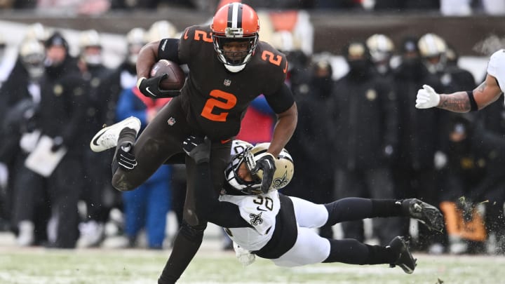 Dec 24, 2022; Cleveland, Ohio, USA; Cleveland Browns wide receiver Amari Cooper (2) is tackled by New Orleans Saints safety Justin Evans (30) during the first half at FirstEnergy Stadium. Mandatory Credit: Ken Blaze-USA TODAY Sports