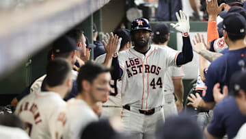 Houston Astros designated hitter Yordan Alvarez celebrates with teammates in the dug-out  after hitting a home run in 2024.