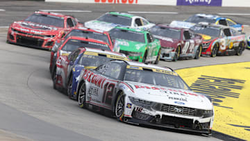 Oct 26, 2025; Martinsville, Virginia, USA; NASCAR Cup Series driver Ryan Blaney (12) leads during stage three of the Xfinity 500 at Martinsville Speedway.