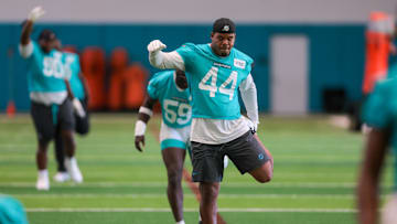 Miami Dolphins linebacker Chop Robinson (44) stretches during mandatory minicamp at Hard Rock Stadium.