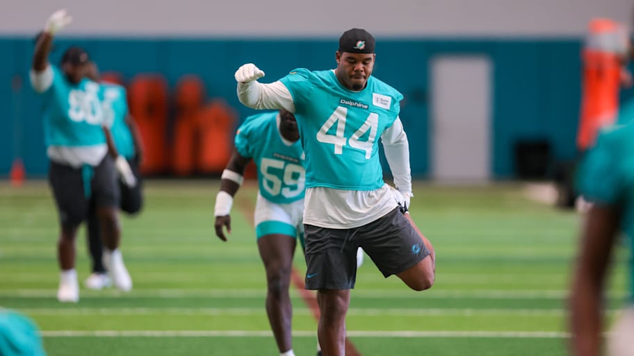 Miami Dolphins linebacker Chop Robinson (44) stretches during mandatory minicamp at Hard Rock Stadium. | Sam Navarro-Imagn Images