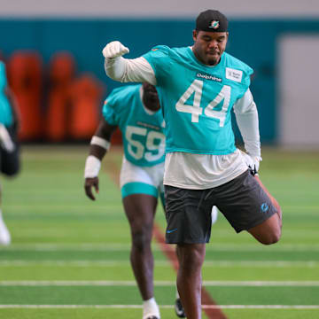 Miami Dolphins linebacker Chop Robinson (44) stretches during mandatory minicamp at Hard Rock Stadium. 
